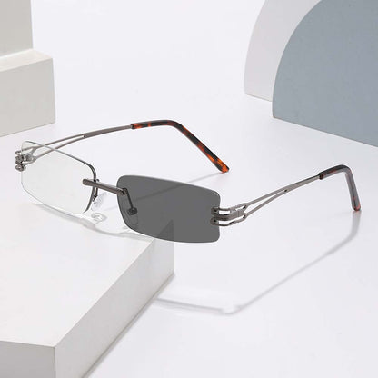 Gunmetal rimless sunglasses with tortoiseshell temple tips and rectangular lenses