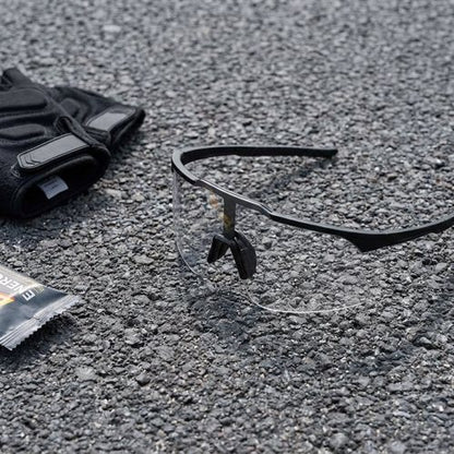 UV400 Shield Sports Sunglasses flat lay with cycling gear